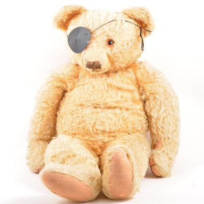 Lot 99 - A large 1930s gold plush teddy bear, jointed limbs, straw filled, 67cm length.