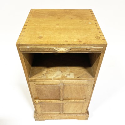 Lot 534 - An Arts and Crafts oak bedside pedestal cupboard, by Peter van der Waals for Claude Biddulph