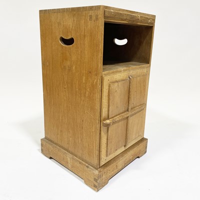 Lot 534 - An Arts and Crafts oak bedside pedestal cupboard, by Peter van der Waals for Claude Biddulph