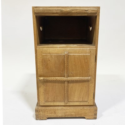 Lot 534 - An Arts and Crafts oak bedside pedestal cupboard, by Peter van der Waals for Claude Biddulph