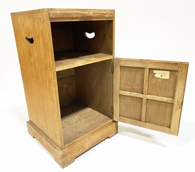 Lot 534 - An Arts and Crafts oak bedside pedestal cupboard, by Peter van der Waals for Claude Biddulph