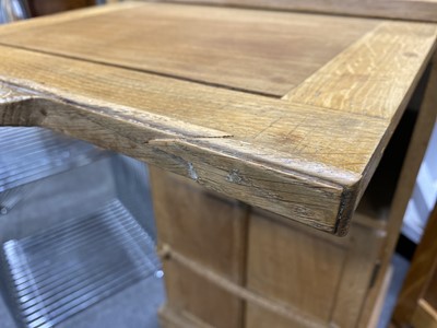 Lot 534 - An Arts and Crafts oak bedside pedestal cupboard, by Peter van der Waals for Claude Biddulph