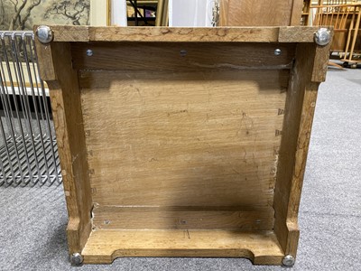 Lot 534 - An Arts and Crafts oak bedside pedestal cupboard, by Peter van der Waals for Claude Biddulph