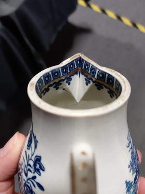 Lot 16 - A Caughley blue and white sparrow beak jug and a First Period Worcester tea caddy