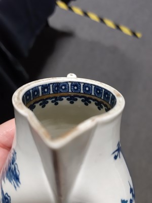 Lot 16 - A Caughley blue and white sparrow beak jug and a First Period Worcester tea caddy