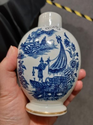 Lot 16 - A Caughley blue and white sparrow beak jug and a First Period Worcester tea caddy