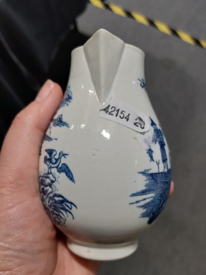 Lot 16 - A Caughley blue and white sparrow beak jug and a First Period Worcester tea caddy