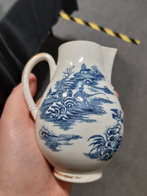 Lot 16 - A Caughley blue and white sparrow beak jug and a First Period Worcester tea caddy