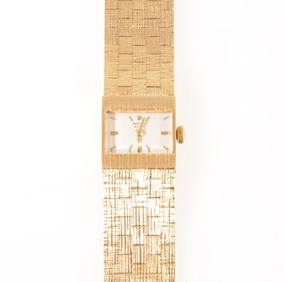 Lot 158 - Record - a lady's 9 carat yellow gold bracelet watch.