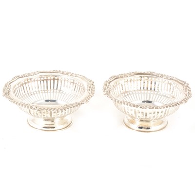 Lot 208 - A pair of silver circular bonbon dishes.