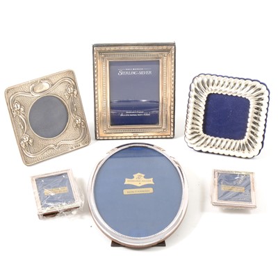 Lot 215 - An Edwardian silver photograph frame, and five modern silver frames