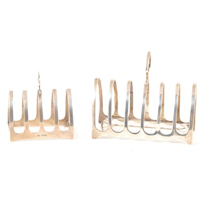 Lot 174 - Two silver toast racks, six and four section.