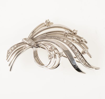 Lot 61 - A white metal diamond set spray brooch.