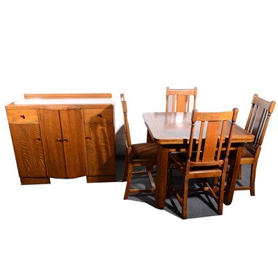 Lot 30 - A 1940s oak dining suite