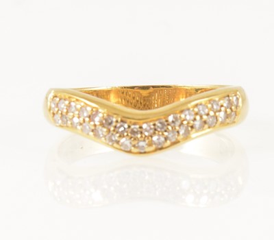 Lot 17 - A diamond set wishbone ring.