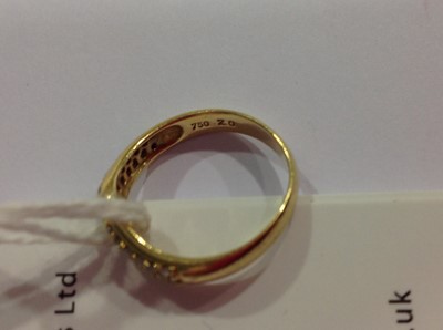 Lot 17 - A diamond set wishbone ring.