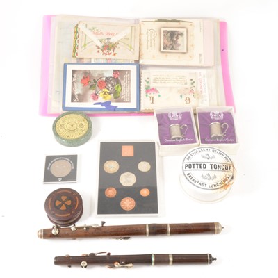 Lot 144 - A small folder of early 20th Century postcards, commemorative coins, etc