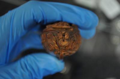 Lot 75 - A carved coquilla nut snuff box, designed as the French ship-of-the-line Victoire