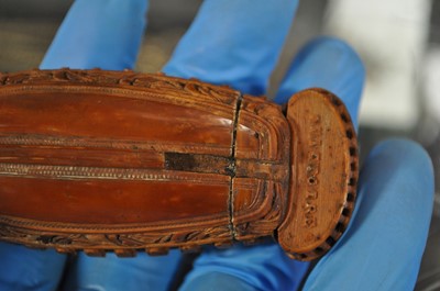 Lot 75 - A carved coquilla nut snuff box, designed as the French ship-of-the-line Victoire