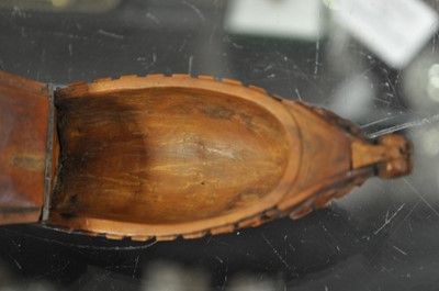 Lot 75 - A carved coquilla nut snuff box, designed as the French ship-of-the-line Victoire