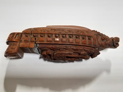 Lot 75 - A carved coquilla nut snuff box, designed as the French ship-of-the-line Victoire