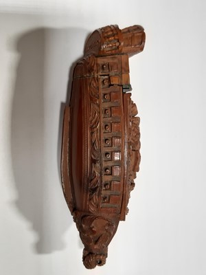Lot 75 - A carved coquilla nut snuff box, designed as the French ship-of-the-line Victoire