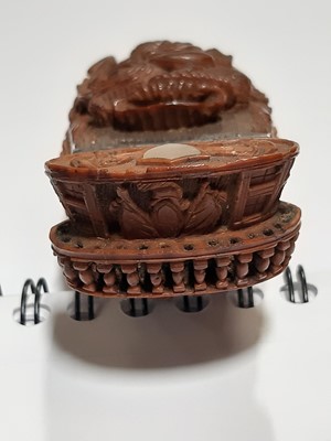 Lot 75 - A carved coquilla nut snuff box, designed as the French ship-of-the-line Victoire
