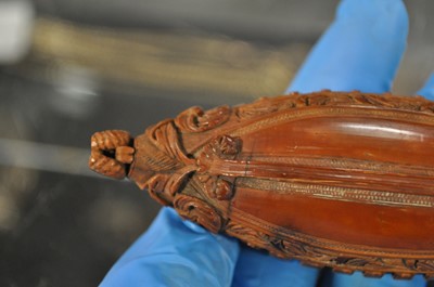 Lot 75 - A carved coquilla nut snuff box, designed as the French ship-of-the-line Victoire