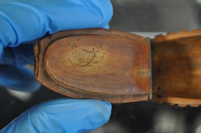 Lot 75 - A carved coquilla nut snuff box, designed as the French ship-of-the-line Victoire