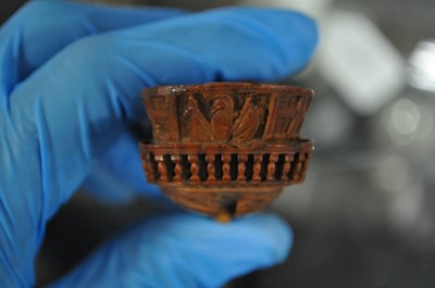 Lot 75 - A carved coquilla nut snuff box, designed as the French ship-of-the-line Victoire