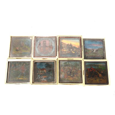 Lot 182 - Sixteen coloured magic lantern slides, in a tin box
