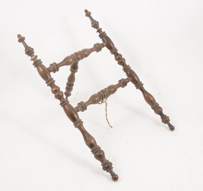 Lot 1114 - A turned beech folding stand