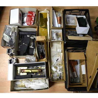 Lot 109 - A large quantity of gauge 1 / G scale model railway spares, including part kits, wheels, chassis, metal plates, gauges, small metal parts, electrical parts, locomotive bodies, part built