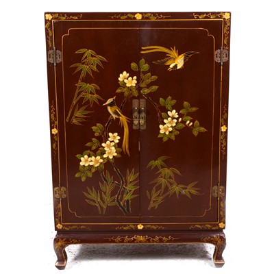 Lot 25 - A Chinese brown lacquered side cabinet