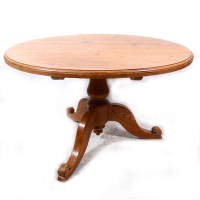 Lot 116 - A modern pine pedestal breakfast table, and four chairs