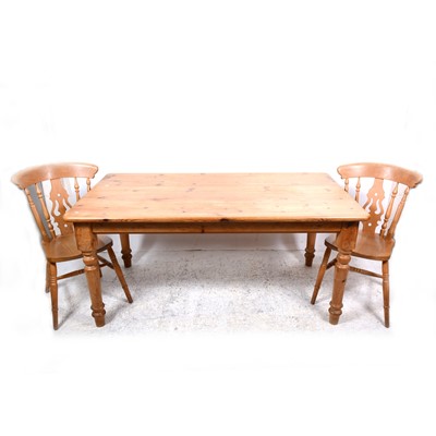 Lot 136 - A pine kitchen table and four chairs