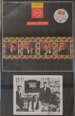 Lot 84 - Level 42 and The Beautiful South; signed photos, framed and glased.