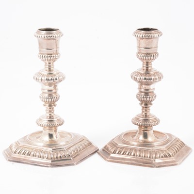 Lot 217 - Pair of Queen Anne Britannia silver candlesticks, John East, London 1702.