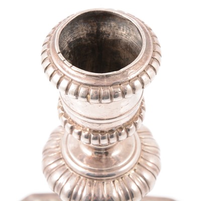 Lot 217 - Pair of Queen Anne Britannia silver candlesticks, John East, London 1702.