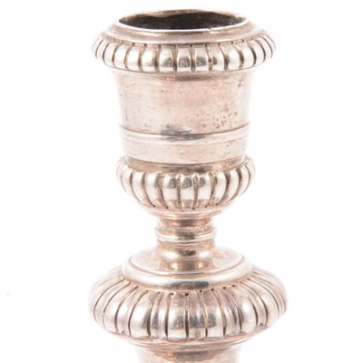 Lot 217 - Pair of Queen Anne Britannia silver candlesticks, John East, London 1702.