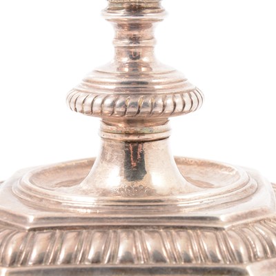 Lot 217 - Pair of Queen Anne Britannia silver candlesticks, John East, London 1702.