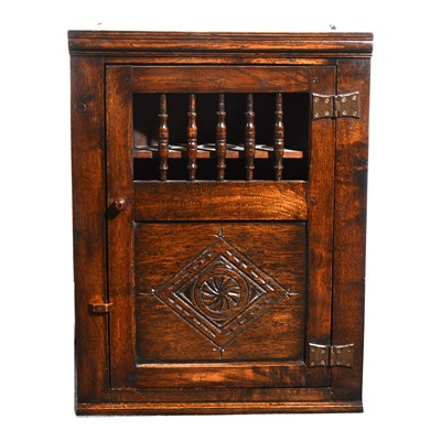 Lot 55 - A stained oak hanging corner cupboard