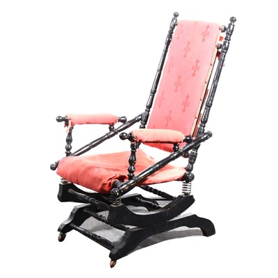 Lot 85 - An American turned wood and ebonised rocking chair