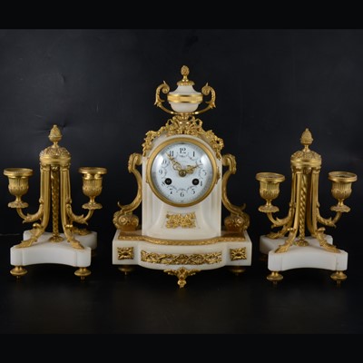 Lot 147 - A Louis XV style white marble and gilt metal three-piece clock garniture