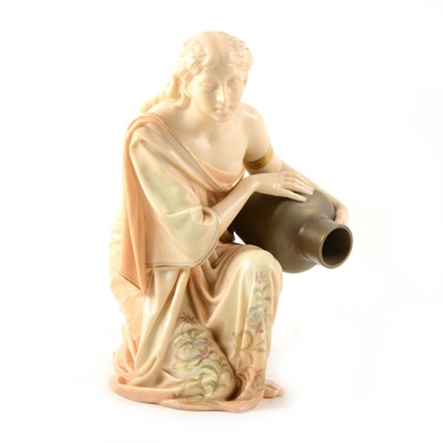 Lot 29 - A Royal Worcester kneeling water carrier.