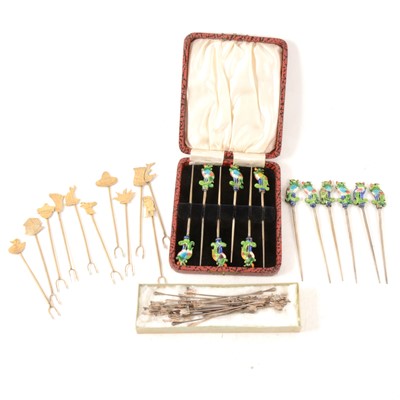 Lot 89 - Four sets of white metal cocktail sticks.