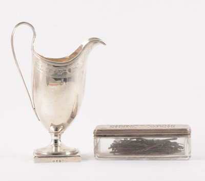 Lot 93 - A George III helmet-shape pedestal cream jug, London 1792