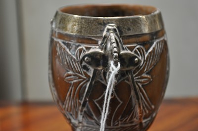 Lot 90 - A white metal mounted coconut cup of ovoid form, pricked date 1590