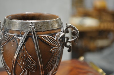 Lot 90 - A white metal mounted coconut cup of ovoid form, pricked date 1590