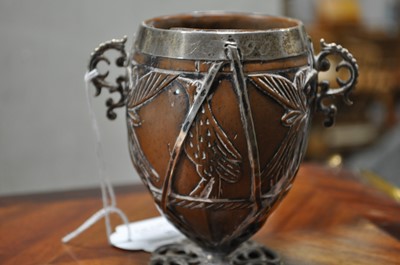 Lot 90 - A white metal mounted coconut cup of ovoid form, pricked date 1590